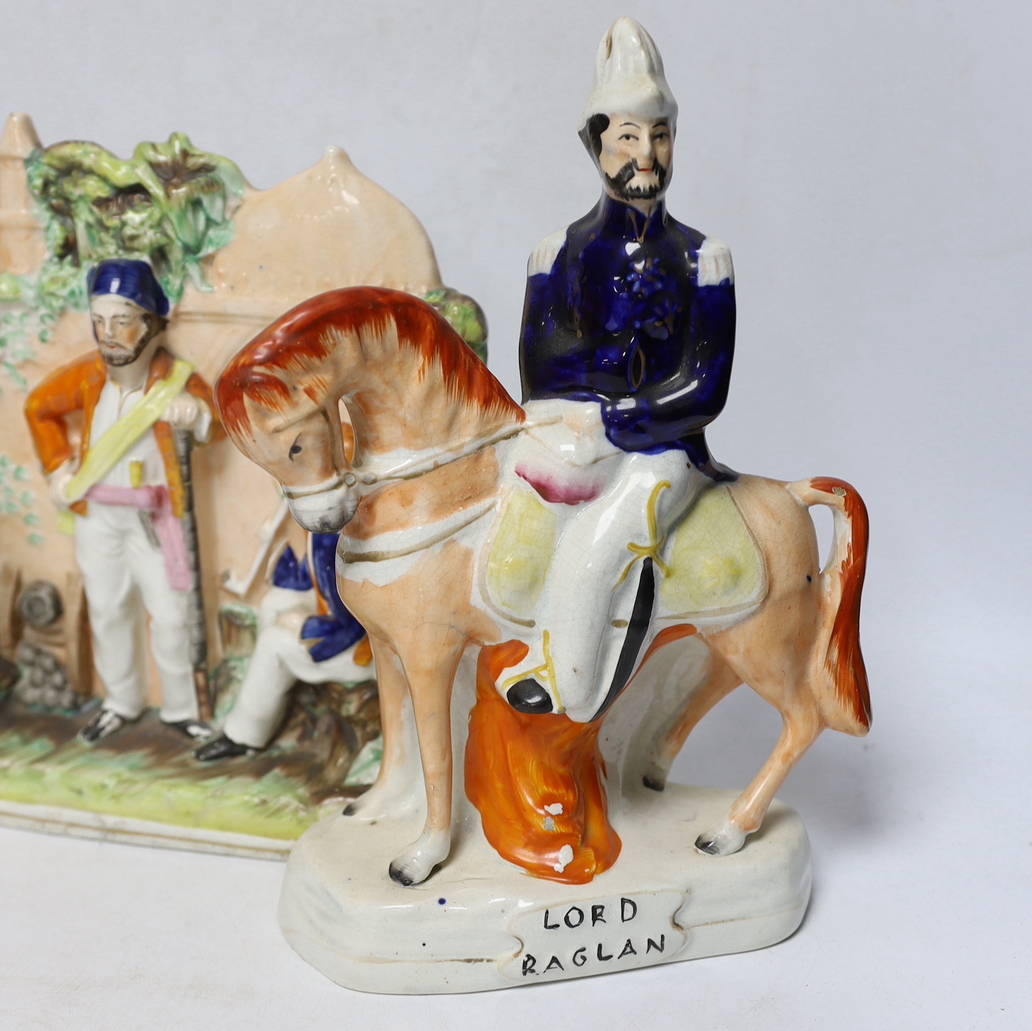 Three mid 19th century Staffordshire figure groups including Lord Raglan and Marshal Arnaud and Turkish soldiers, tallest 26.5cm